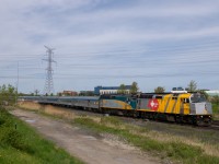 When VIA unveiled its wraps for Canada 150 in 2017, the splash of extra colour was a welcome sight across the country. To celebrate the 40th anniversary of VIA Rail Canada in 2018, the wraps were modified, as seen here. With a friendly wave from the seasoned engineer, VIA number 1 crosses from York 2 to the south track to head east towards Doncaster and points north.<a href="http://www.railpictures.ca/?attachment_id=28998"> 6454 at Oriole in 2017 </a><a href="http://www.railpictures.ca/?attachment_id=28999"> 6454 at Sunnyside in 2017 </a>