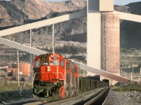 M636 45 leads empty ore train through the loading silos at Cartier Mining's Mont Wright mine at the north end of the railway