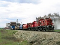 The White Fox Subdivision wayfreight from Prince Albert with 3 RS23's drops its train of grain loads at the south end of Nipawin yard before picking up empties to spot on return trip. The loads will eventually move south via Sheho and connection with the CP's north main. This was done rather than moving traffic via Prince Albert to avoid per axle running right charges on CN