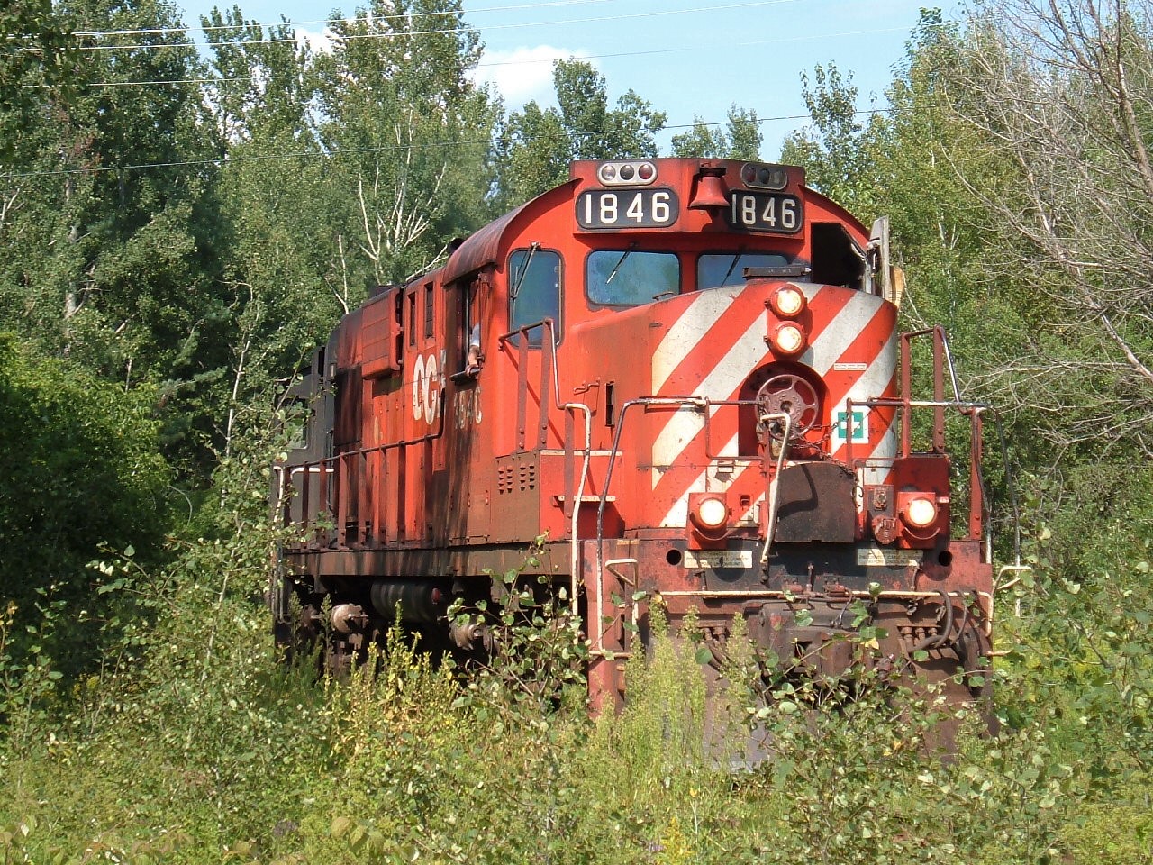 A old shot of the once was a railroad town serviced by CP/OVR and CN/OCR. Now all that is left are trails and memories. This picture is of the OCR Ottawa-Pembroke Turn which just finished working the Smurfit-MBI plant. Today's work included a single 50ft boxcar set off and 1 picked up. The track radius was very tight and the flange squeal was quite the sound.