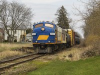 <b>HAPPY FRONT END FRIDAY!</b> Being such a nice day for a drive and having to go to St. Thomas anyways, I arrived early before my appointment and had a little time to kill. So, why not venture over to the CN yards, and see if there's any action by way of the OSR. Wouldn't you know it....just having arrived into the yard with a decent string of tankers to be dropped, was 1400 and 6508. However, having seen previous posts, hoping one could clarify if this was the 'Cayuga Clipper' or the 'Tillsonburg Turn'. Nonetheless, talk about 'pomp and circumstance', but really just plain LUCK!
<br>
<br>
After waiting a few minutes, they switched out and reversed out of the yard down the former CN Cayuga Subdivision. Note to the left of 1400 the ties are still in place of where the line was double tracked, likely just a siding. One can only imagine the days of previous F-units for all different roads using this line. Thankfully St. Thomas still retains not only some action, but keeps its railway history intact despite losing some vital pieces through the years. 