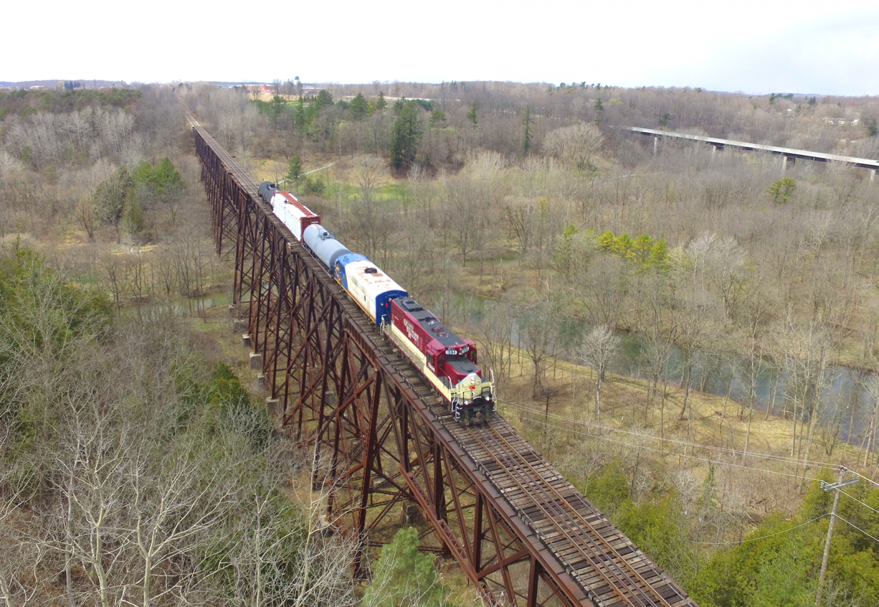 With the possible abandonment, CN's Cayuga sub has gotten a bunch of fame over the past 2 weeks. Operated by OSR once a week, railfans flocked from all over Southwestern Ontario this past thursday to capture what could very well be one of the last trains to traverse the line. With the St. Thomas job being combined with this job that day we were treated to a pair of higher horsepower units, instead of the nose to nose ex. CP pups. Here we see the train crossing Big Otter creek on one of the impressive trestles which are along this line.