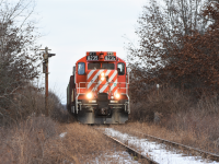 One of the last trains to traverse the Cayuga sub East of Tillsonburg. OSR 8235 and GP9 counterpart 1594 pull a cut of three 3 bay hopper cars past the old CN installed approach signal to the Port Burwell diamond with CP. Today marked likely the final time a revenue freight will traverse the Cayuga sub as OSR is pulling out which in turn will likely force CN to put it up for abandonment. 