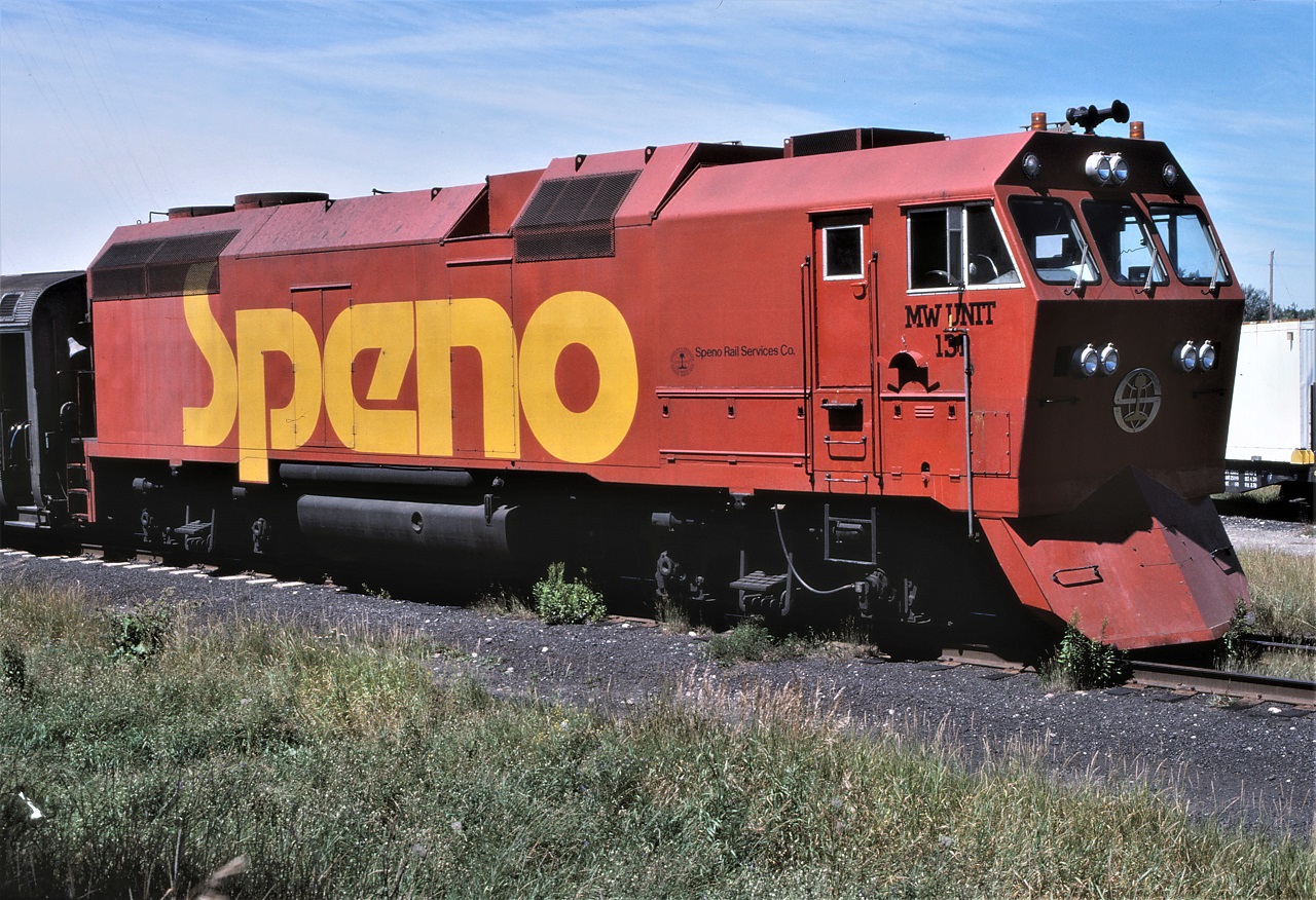 The locomotive of the Speno rail grinding train is pictured on the wye track at Capreol, Ontario.  This has to be one of the more ugly GP38-2s ever created!