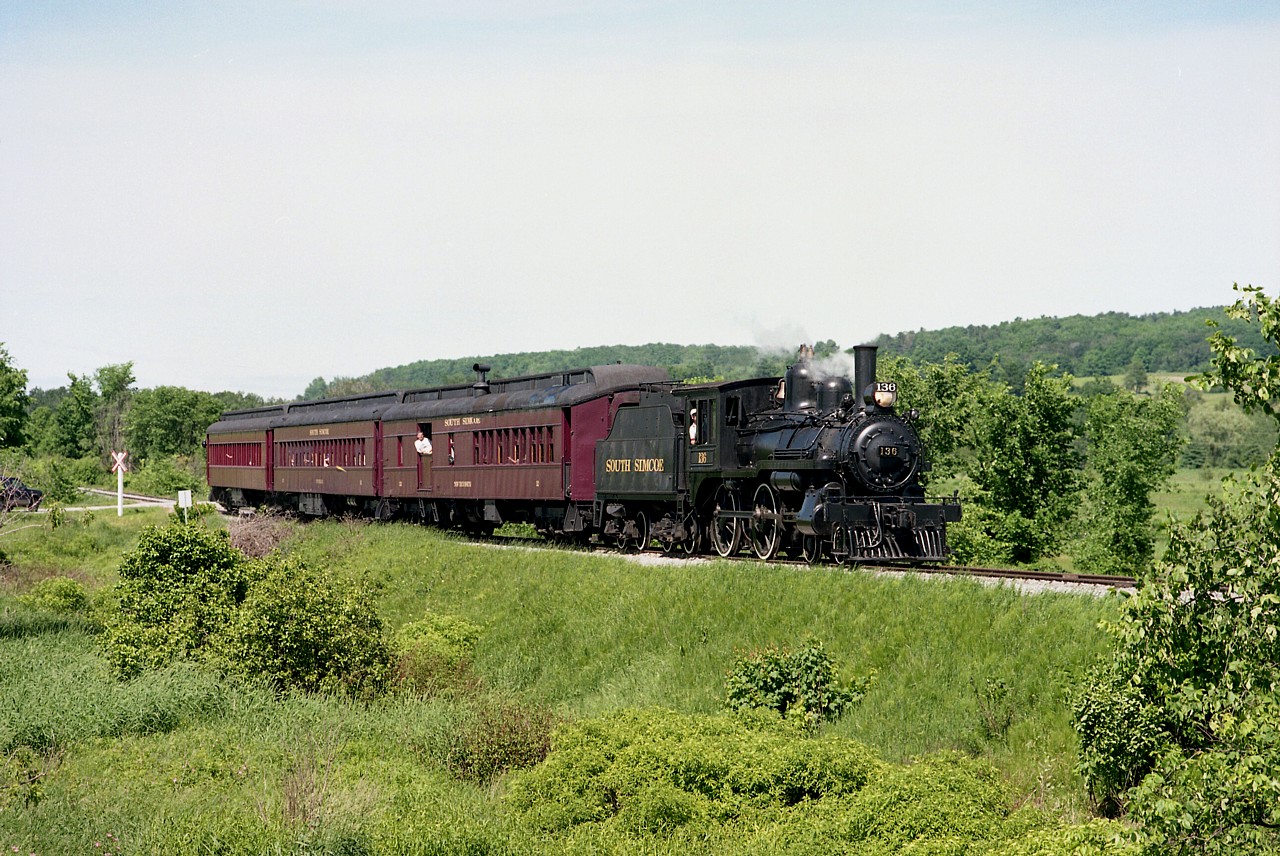 A typical South Simcoe Railway Sunday excursion run from Tottenham to Beeton and return. The 1883-built 4-4-0 Rogers Locomotive Works product is still on the SSR property. It underwent extensive restoration in the past 10 years and is still used on some excursions, to my knowledge. Rather famous locomotive; has been part of several TV shows...National Dream for one, and is, in my mind, a National treasure.