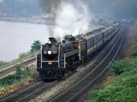 We didn't know how lucky we were in the late 70's and early 80's when it came to railfanning.  CN ran twice weekly excursions between Toronto and Niagara Falls, and special excursions were running all over North America, be it steam or diesel. In July 1980, the NRHS had its Annual Convention in Toronto, and there were trips over GO, CN, the TTC and tours everywhere. A Southern F7 even occupied a stall at Spadina ! In this scene, CN 6060 puts on a great show as she returns from The Falls with an NRHS train.      