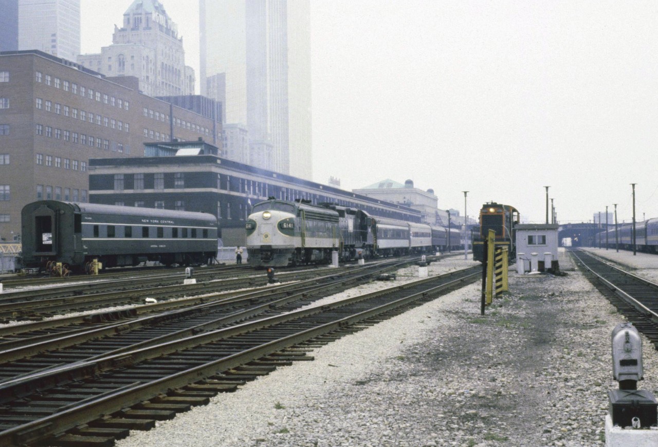 While admittedly not the best image as far as quality goes, I was swayed to post it due to the great discussions arising from a previous 6060 posting.  Other than the Royal York and maybe that CN S13, for a moment Toronto Union looks more like a US terminal. A New York Central sleeper in the business car track and a Southern F7 and N&W unit on a passenger train ?? For the previous week, the NRHS had held its Annual Convention in Toronto and what a time it was. The Southern and N&W units were heading home to Roanoke VA and the NYC sleeper which had arrived on the Southern powered train made its way home on regular trains.
Indeed it was quite a week.