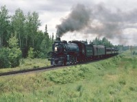 Ex CP 1201 certainly has her train in stride as she heads south on the CN Newmarket Sub towards South River.
The date is Aug 11 1982, and 1201 has been brought to North Bay to help celebrate the 100th Anniversay of the city.  Excursions were operated over the CN between North Bay and South River. A wye at South River allowed the train to be turned for the return trip.