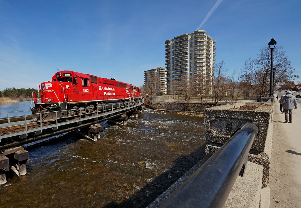 A rare bird

CP 4522 started out as UP 9003 a GP40X, now rebuilt by NRE as a GP38-2 and kept her flared radiators! Her and her Canadian sister shove back an empty rail train down the Waterloo Sub after dropping rail just south of the bridge.