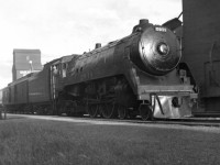 The Brandon to Regina local passenger train with F1a 4-4-4 2911 on the point works the station while the engineer looks back for the signal to depart. F1a's unlike the high speed streamlined F2's were used on local passengers on the prairie region along with G5 4-6-2's