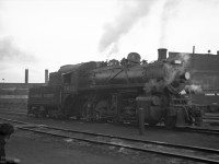 CP 3632, a class N2A 2-8-0 built by CLC in 1911, was one of CP's last steam engines in regular service. <br>
It served at Port McNicoll Ontario in the last month of regular steam operation on the CPR, April 1960.<br>
This image dated May 1960 appears to be outside Lambton roundhouse (with its numbered smoke jacks).<br>
CP 3632 is in steam and getting some attention - note the steam dome cover is off, temporarily placed on the sand dome. The guys at bottom left might be taking a break from this activity.<br>
In the background CP 8558, an RS-10 built by MLW in 1956, is on the roundhouse turntable. 