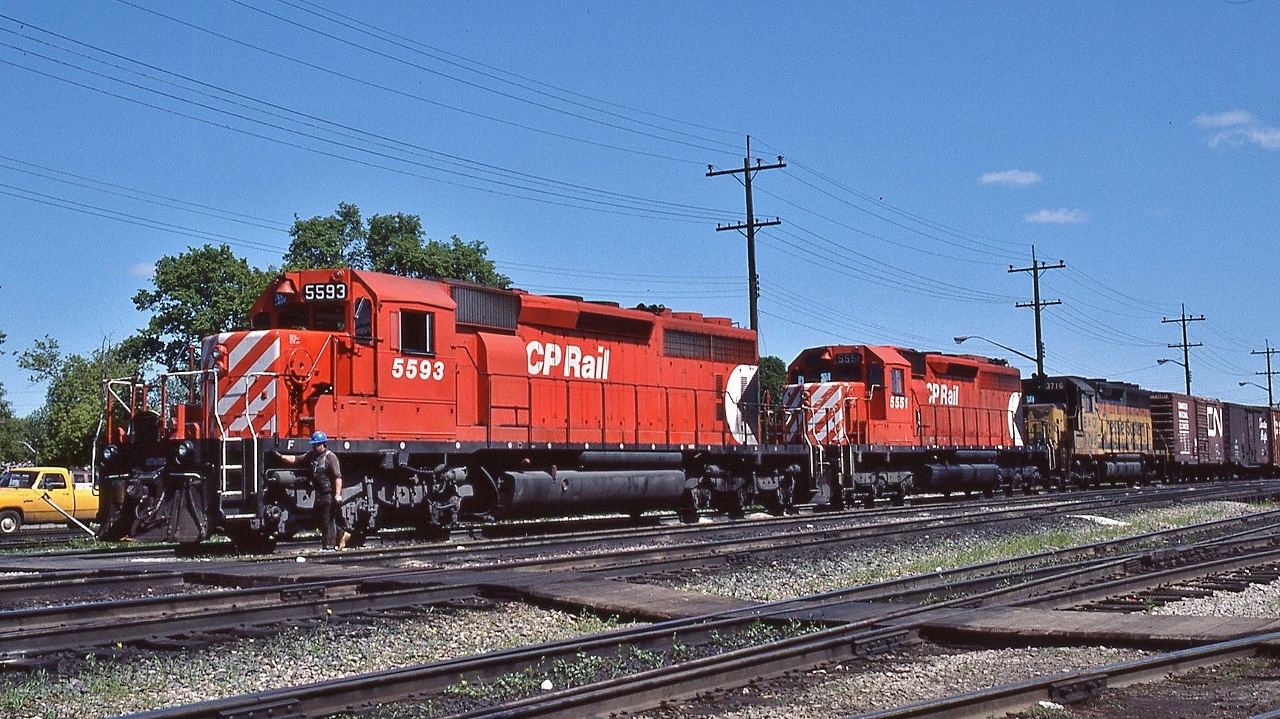 After the DAILY VIA departure CP Rail #407 with 5593  /  5551 /  B & O (Chessie) 3716  prepares to follow # 1


 At CP Rail Thunder Bay June 19, 1985 Kodachrome by S.Danko. 


   VIA #1 at Thunder Bay station   


 What's interesting: 


  SD40-2 's ruled on CP Rail


 CP Rail owned 80 SD40 and 489+ SD40-2


 CP Rail #5551 class DRF-30b2 built 1967 as a SD40, then upgraded to SD40-2 electrical specifications


 B & O  ( Chessie *  ) #3716 is an EMD GP40


   [  *  The Chessie System paint scheme officially lived only 14 years: unveiled September 1972 and  ending July 1, 1986  when  the   C  &  O    merged into CSX Transportation    ( B  &  O merged into C & O April 1986 )  ]


 sdfourty