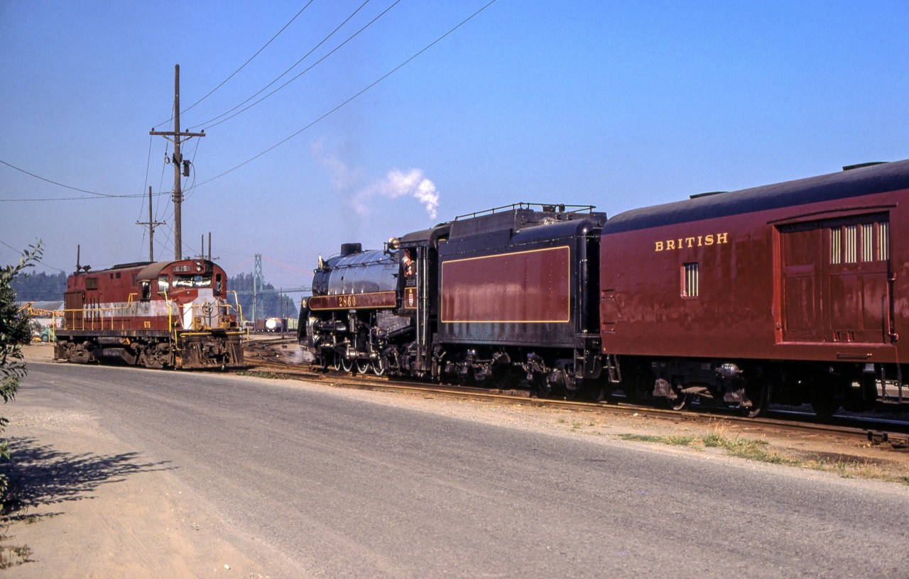 It is August 3, 1974 at the BC Rail yard in North Vancouver where BC Rail 2860 is in a meet with MLW 676 (ex-UP ALCO RS-27).