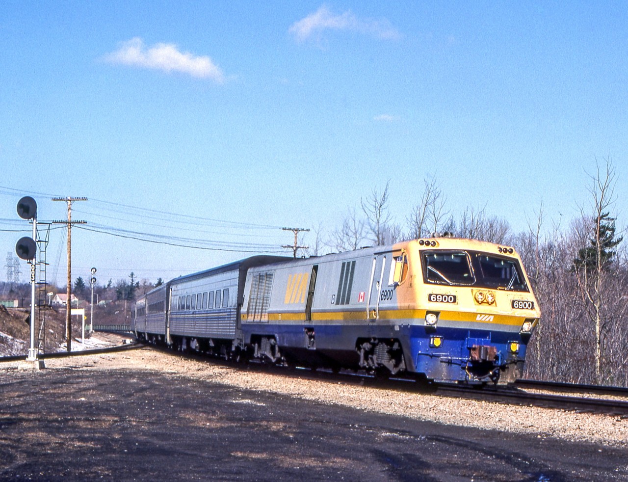 VIA 6900 is eastbound at Hamilton West in Hamilton, Ontario on March 27, 1984.