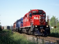 St. Lawrence & Hudson Railway train 270 is at Guelph Jct. swinging off the Galt Sub. and on to the Hamilton Sub. with STLH 5627, HLCX 5036, and CP 5518.  That is if I'm reading my scribbles on the slide mount correctly.  And I thought my printing was messy now.  Yikes.