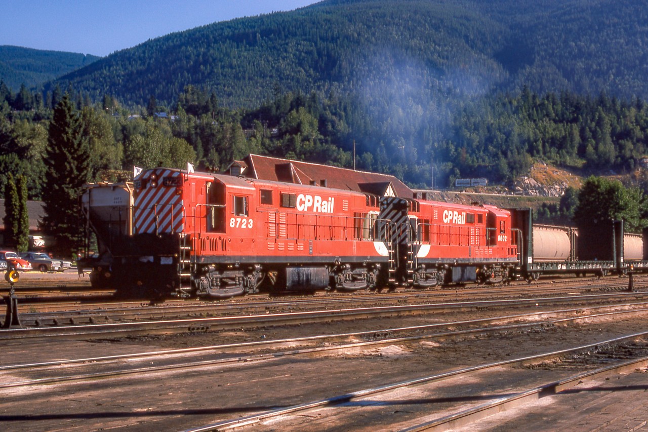 CP 8723 and CP 8602 and their train are in the CP yard in Nelson, British Columbia on July 31, 1974.