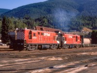 CP 8723 and CP 8602 and their train are in the CP yard in Nelson, British Columbia on July 31, 1974.