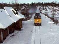 With a nod to Mitchell Gault’s evocative <a href="http://www.railpictures.ca/?attachment_id=40765" target="_blank">image</a>, VIA F40PH-2D No. 6444 is shown gliding to a stop at St. Marys Ontario. Compare the foliage growth that has occurred over the intervening twenty-two years along with the renewed Station Sign. Tragically, No. 6444 would be involved in a lethal <a href="https://www.tsb.gc.ca/eng/rapports-reports/rail/2012/R12T0038/R12T0038.html" target="_blank">derailment</a> east of Aldershot Ontario on February 26th 2012 and be removed from the roster the following year.