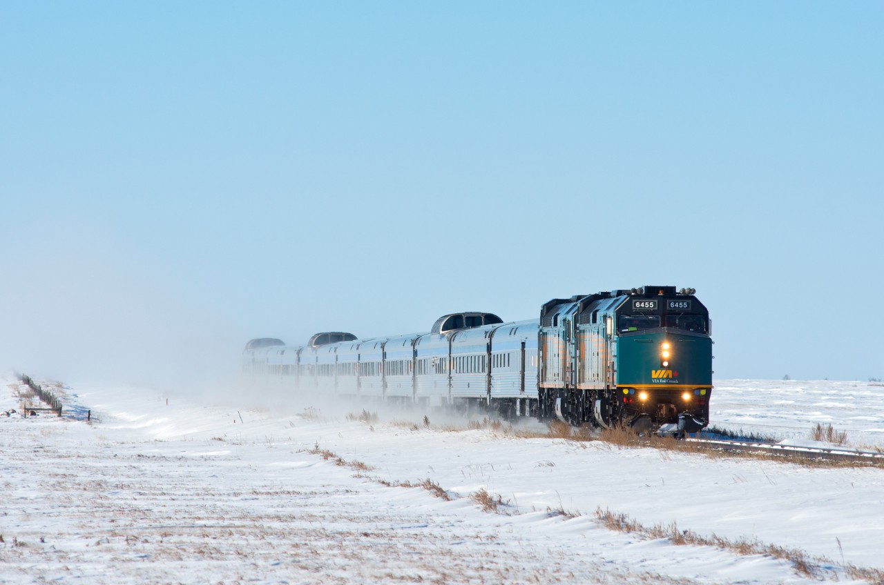 A very late VIA#2 is seen racing through the frozen prairies at Scott Saskatchewan with a short off-season consist.