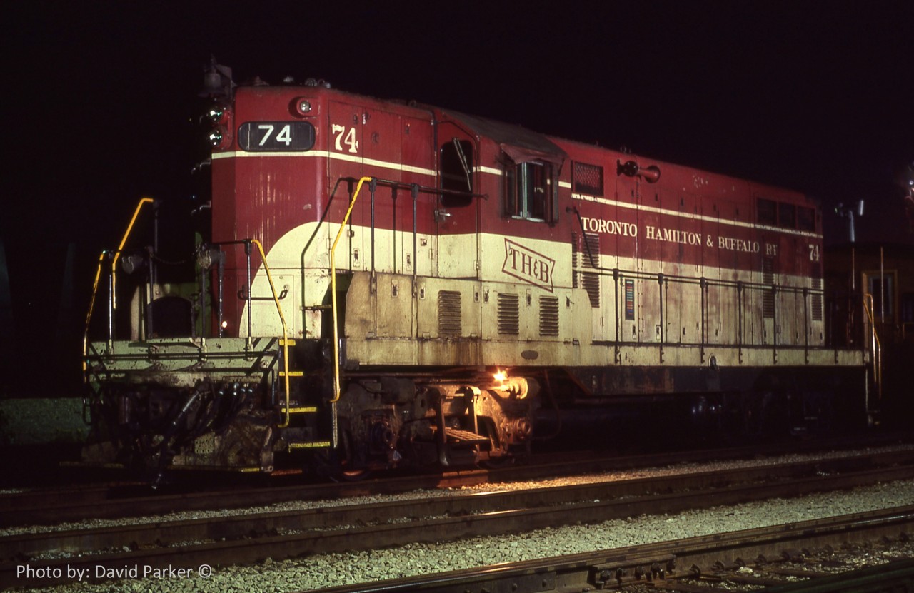 A day trip to the Niagara Region with my late friend Mike McIlwaine on Aug 18th 1980. Our last stop before heading home to Windsor was the CR/THB Welland Yard where we found GP-7 74 just waiting to be lit up by a few flash bulbs.