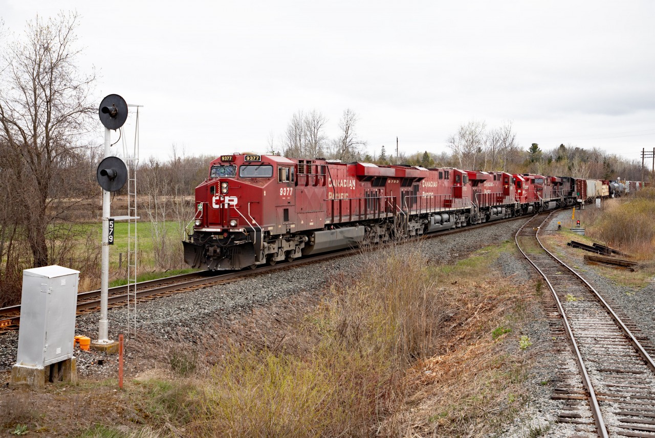 CP 420 has just finished lifting 5 cars from the BCRY interchange at Utopia, and is preparing to proceed south now the Conductor is back aboard. Five units on the head-end today, 9377 8793 9365 3055 and 8717. On the tail-end was a GO bi-level from Thunder Bay.