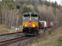 Searchlight signal, a grey nose with beaver shield and a consist of boxes, tanks, hoppers and flats almost put me into a " back to the future " scenario on this dull cold Friday afternoon.  Advice that 421 had 7016 as the lead had me out the door in short order.  Heading towards the Mactier Sub, thoughts of lighting were establishing and eliminating spots until the RTC advised 421 he'd be meeting 112 at Palgrave.  Definitely the first spot would be near the south switch as 421 would have to stop for the Conductor to get the self-restore switch before pulling into the siding.  The decision paid-off. Got this and a few other shots before he headed to Spence for some work.     