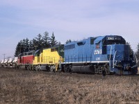 GEXR #432 heads East on the CN Halton Sub crossing Winston Churchill Blvd with a colourful consist leading some flats full of new military vehicles from GMDD London.