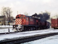 CP's London Pick-Up is putting on a smoke show in front of the Galt station as it heads toward the mainline after going around the wye with C424's 4212, 4216 and RS-18u 1813. At the time, this assignment ran Monday-Saturday from London to Galt to set-off and lift traffic for Toyota as well as service other customers along the mainline as required. 