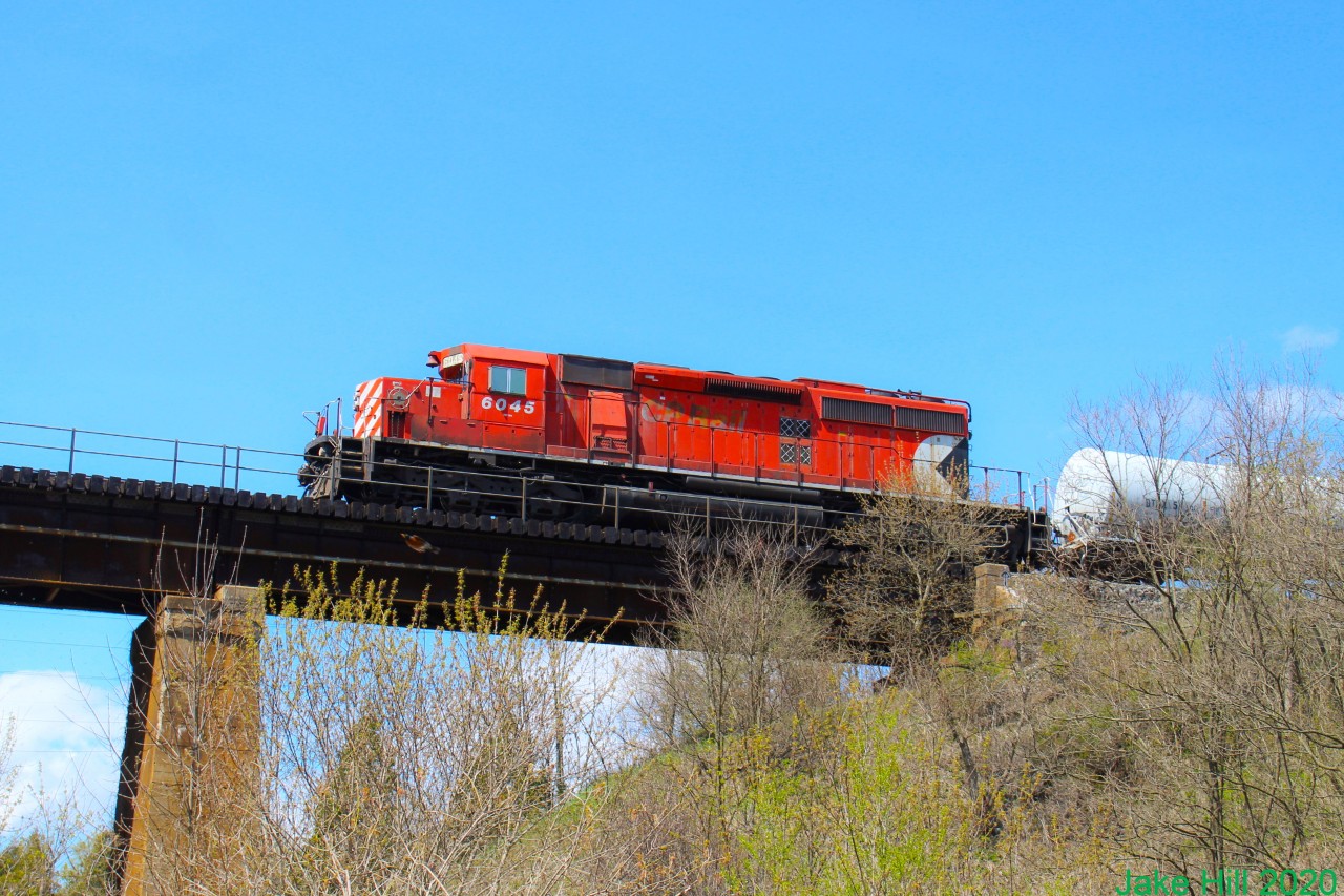 I woke up that morning with a text saying a SD40 was coming by so I rushed to the tracks. After waiting almost three hours it came by. It was only going about 10 MpH. It was the weed sprayer train. It left a bad smell in the air but it was totally worth it.