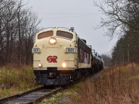 “Last Stand”

OSRX 1401 & 6508 take charge of the final “Cayuga Clipper” through Belmont Road just west of Aylmer, ON. 

Today was definitely a day to go down in history, as the last revenue freight train rode the rails of the “Canada Air Line” from Tilsonburg to St Thomas today. Over the 147 years this line has existed, it has seen its fair share of operators, including CN,CP, TH&B, NW/NS, and many more. Known officially as the CN Cayuga Subdivision until 1995, it linked the once extremely busy St. Thomas (aka Railway City) with Buffalo, NY. After CN abandoned the majority of the line in ‘95, the remaining portion from St. Thomas to just east of Tilsonburg was renamed the Cayuga Spur, and only existed for industries located along the line who still requested rail service. Since then, the line has seen use from Trillium as well as OSR but as far as I know, operations became fewer and further between as customers along the line either started to leave or switch to trucks. Since the line was no longer feasible to the current Operator (OSR) the decision was made to pack it all up, with only one industry remaining on the line. For the past couple weeks, OSR has been picking up cars which have sat in sidings for years, even decades in some cases (see @boxcar_gaynor ‘s profile for pictures of some old CASCO tank cars) and dragged them out in preparation for abandonment. Although nobody knows the actual future for the line, it’s nearly impossible to be optimistic considering the stories for many of Ontario’s rail lines have been all too similar to this one. But regardless of if it is or isn’t the last train to ride these rails, I’m glad to have seen history in the making today. (Please correct me if I made any mistakes in the caption!)