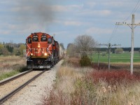 CN 568 is all red today thankfully after weeks of it being a pair of obnoxiously, unpleasant (for me) blue GMTX geeps surrounding 4790. 4136, 4125, 7083, and 4790 are pulling hard taking 568’s tonnage up the dip west of Shakespeare. It was an interesting hand off today, a later 540 arriving at Kitchener just short of 13:00 being replaced by 568’s crew immediately as 540 terminated in Kitchener making the handoff between assignments quick and ideal for getting 568 in good light west of Kitchener. 