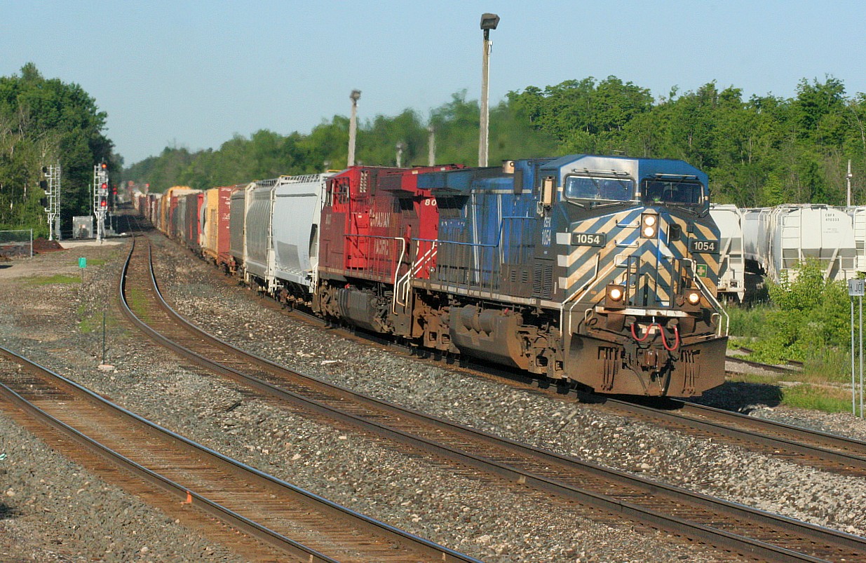 CP 234 with CEFX 1054 and 8037 break the early morning silence as they depart Guelph Jct. on the Galt Subdivision at 08:15 after setting-off 24 cars for Ontario Southland, which operates the Guelph Junction Railway (GJR).