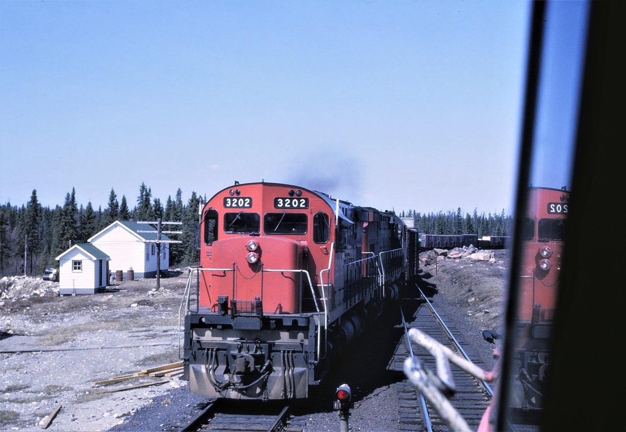 CN train 302 with C424 3202 leading heads into the passing track at Gladwick Ontario for a meet with the westbound Panorama.  Hard to believe that this picture was taken 53 years ago this month!