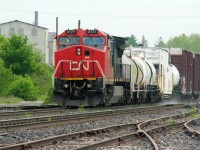 CN 2177 leads 999, the weed spraying train, westbound through Paris Junction on the Dundas Subdivision just before noon. The train is about to meet #72 ahead and 385 was stopped behind preparing to work Paris. 
