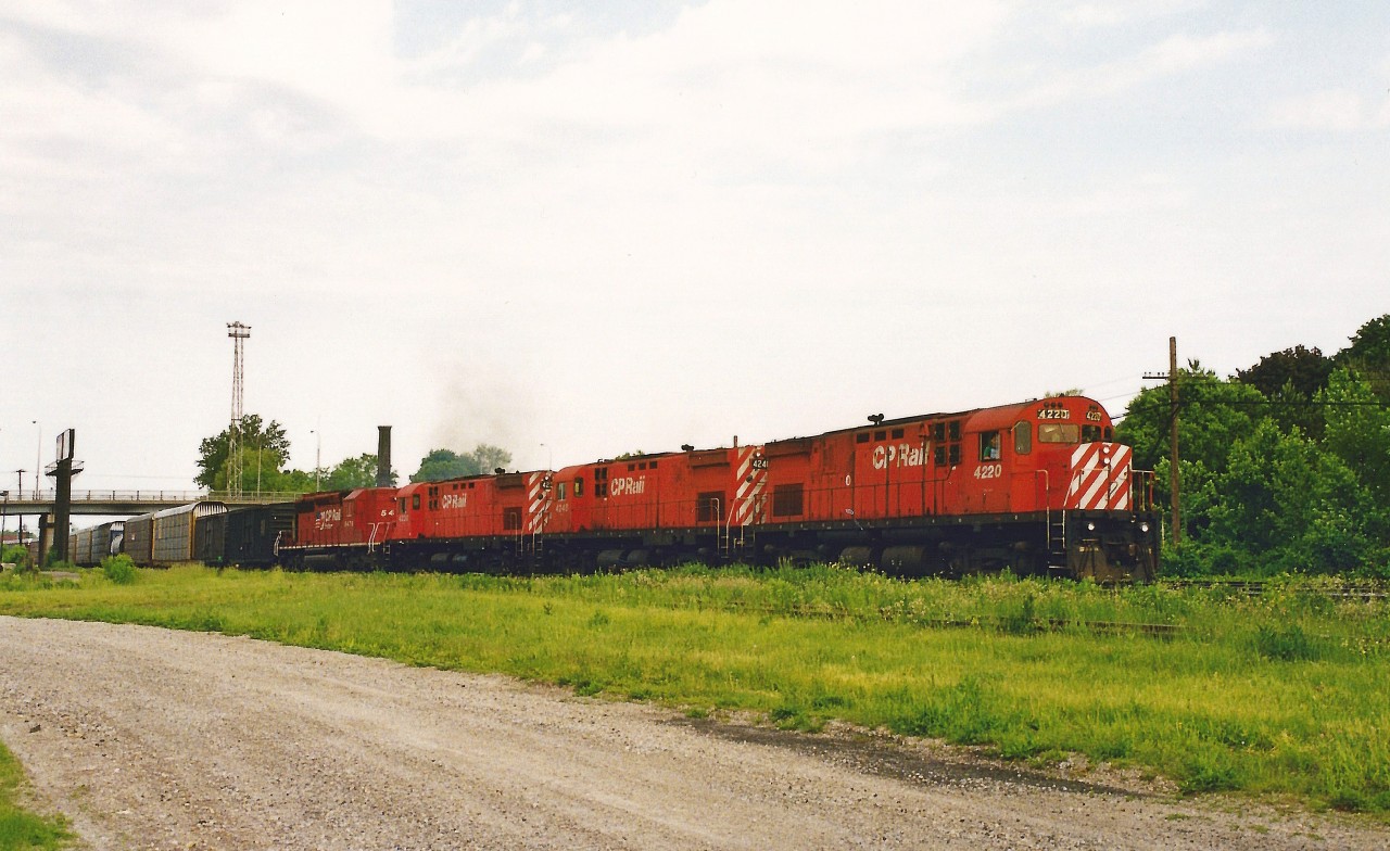 On a hot and hazy summer morning a CP eastbound slowly enters Quebec Street yard in London with a trio of C424's as well as a SD40-2 with a blanked-out cab. The units included; 4220, 4248, 4238 and 5478. CP 5478 is ex-Norfolk Southern 3246 and nee-Southern Railroad 3246.