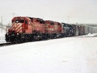 A CP westbound departs Galt, Ontario in a blinding snow squall after lifting two boxcars in the yard. The consist included; CP 5624, SOO Line 758 and an unidentified HLCX leaser. 