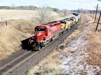 After being slightly delayed by the morning Woodstock Job switching in the yard, a westbound with CP 5655, 5431 and 5428 are accelerating up the grade out of Woodstock as they approach the Highway #2 crossing on the Galt Subdivision. Prior to being acquired by CP both 5431 and 5428 were former GATX leasers, then prior to that were Union Pacific as they originally were built for Missouri Pacific and obtained through the large UP/MP merger. 

