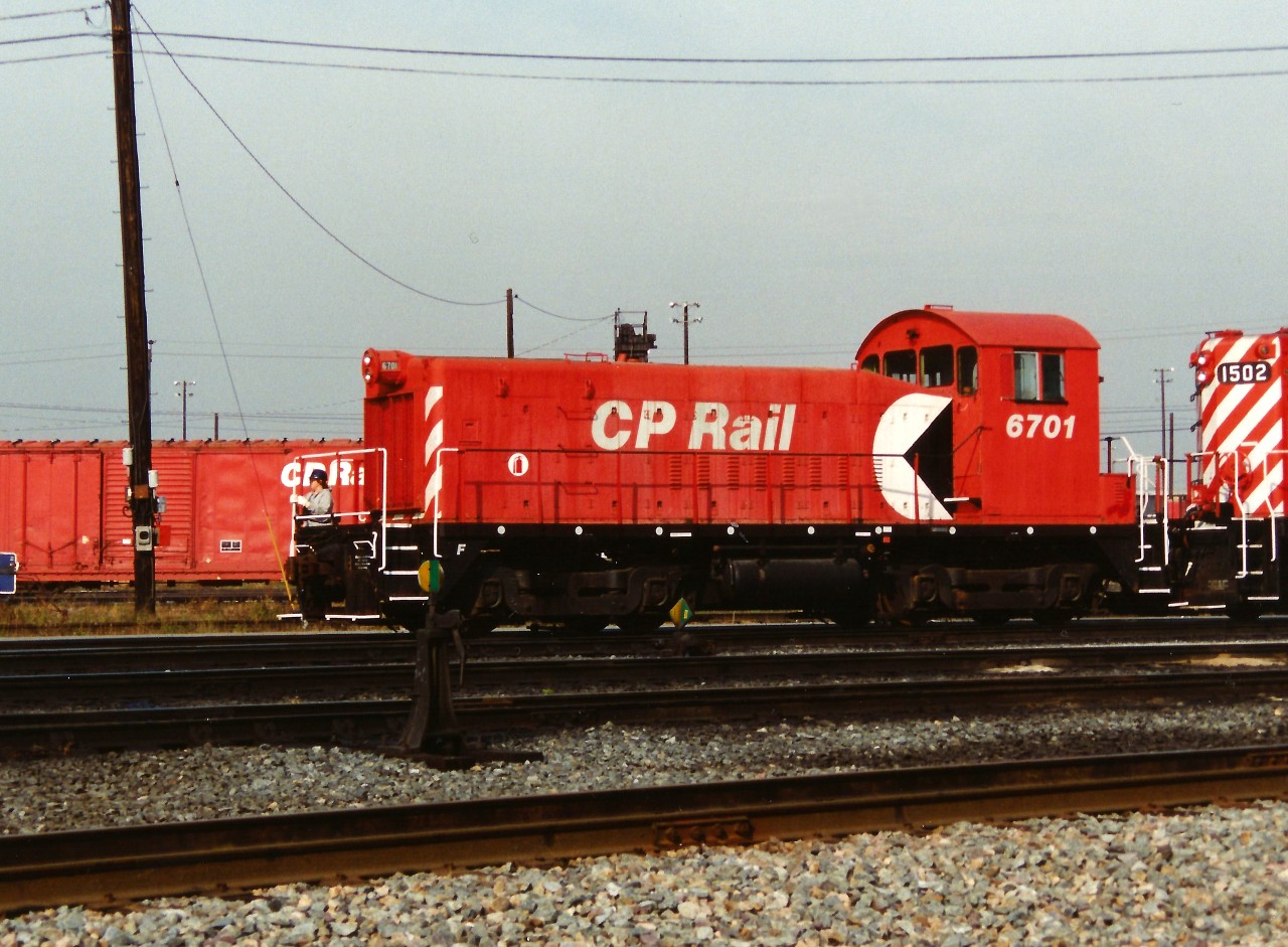 Former CP SW8 6701 had recently been converted to a daughter "Slug" unit and mated with CP GP7u 1502, seen here at CP's Toronto yard. At the time, there were only 4 SW8's remaining on CP's roster when the decision was made to covert 6701 into a slug, having been transferred from British Columbia to Toronto. Two years later in 1996, 6701 was renumbered to 1011 and eventually retired in January 2013. Info compiled from the Canadian Trackside Guide and mountainrailway.com.