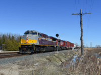 A freshly painted CP 7018 leads 235 around the curve at Tilbury and through the points of East siding switch Tilbury on it's way West towards Oak in Detroit. 