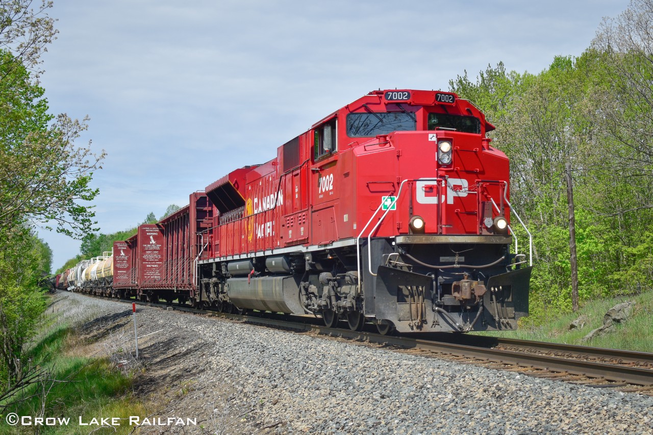 CP 142 powers through Crow Lake with a newer Acu in the lead and another one serving as mid DPU.