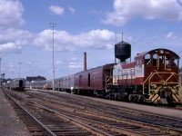 At 11.10 a.m., Sunday, August 20, 1967, the eastbound Canadian, Train 2, rolled into town behind units 1406, 8567 and 1407.  The schedule allowed thirty-five minutes for the splitting of the train into sections for Montreal and Toronto.  They would depart on time with 1407 removed from the consist of Train 2 with FPA-2 4083 and RS-10 8561 leading Train 12 to Toronto.  All units were steam generator equipped.  1407 would turn back west on the next Train 1 at 12.10 a.m. the following morning. <br> <br>With the power pulled well east of the station, S-2 7091 (MLW 2-1949 #75866) went to work.  Train 2 had arrived on the track closest to the station and the crew would rebuild it there.  Train 12 would be readied for departure on the adjacent track.  The usual three lightweight head-end cars, including two dormitory baggage cars, arrived on Train 2.   Each outbound train had one dorm, and 7091 added a car behind the power on Train 2 and two behind the power on Train 12.  Meanwhile, either 7090 or 7092 worked the other end of the Canadian.  <br> <br>   Using the line numbers from the CPR's folder 62-28, the S-2 marshalled the following equipment into each train.  The Toronto section included Sudbury - Toronto coach 223, coach 221 from Vancouver, Skyline cafe dome 222 from Sudbury.  The following cars came from Vancouver:  Manor cars 213, 212, Chateau 211, a diner, Manor 210, and Manor 202 from Regina and Park dome observation 200 from Sudbury.  The Montreal section included coaches 226, 224, a Skyline, Chateaux 208 and 207, Manor 206, Chateau 205, a diner, Manor 204 and Park 201.  Each of the 42 Manor cars from Budd's large order of 1954 included 4 roomettes, 5 double bedrooms, 1 compartment and 4 open sections.  CPR's 29 Chateau sleepers featured 8 duplex roomettes, a drawing room with three berths, 3 double bedrooms and 4 open sections. <br> <br>   The Sunbury Star newspaper pictured the arrival of S-2s, 7090 through 7093 in 1949 not long after their construction and original assignment in Montreal.  The 7090 through 7093 were soon assigned to Sudbury, but the latter soon moved on.  By 1968, 7093 was in Toronto having worked in Smiths Falls.  Reports vary on the assignment of 7094.  Newspapers suggest that it was assigned to Smiths Falls with 7095 in late March 1949 but it is reported to have also come to Sudbury before moving to the Sault and then, by 1968, to Winnipeg. <br> <br>The 1,000 horsepower, turbocharged 6-cylinder 539T diesel was first delivered as the S-2 model by Alco in September 1940.   It came to MLW in Canada as CPR 7077 in May 1948 and it is preserved at Exporail near Montreal as Canada's first production diesel locomotive.  Variations continued in production through April 1957, allowing it and the similarly powered S-4 and S-7 to come within a hair of besting EMD's SW7/9/1200 as  North America's most numerous switcher.   CP Rail sold 7091 to nearby Inco for use in its nickel production facility on Monday, June 16, 1986.  It left their roster for scrapping in 2000 wearing number 204.