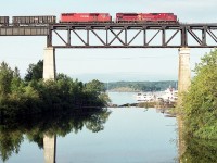 Ah, what a beautiful summer morning!! Northward over the majestic Parry Sound trestle, trailing unit Red Barn 9019 is looking rather diminutive behind that mighty SD90 MAC on the lead.
The 9141 is to undergo upgrades and return to the roster as an SD70ACu in the 7000 series. The Barn went off roster in 2016, dealt to J&L Consulting.