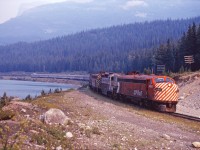 Once the site of a 41 car siding and a flag stop for CPR passenger trains, on this day in August 1971 the next stop for "The Canadian" will be the Field, 12 miles ahead. That's Wapta Lake on the left (and the Trans-Canada Highway is out of sight to the left). Power is CP Rail FP9 1405, GP9 8518, and an unidentified FP7.