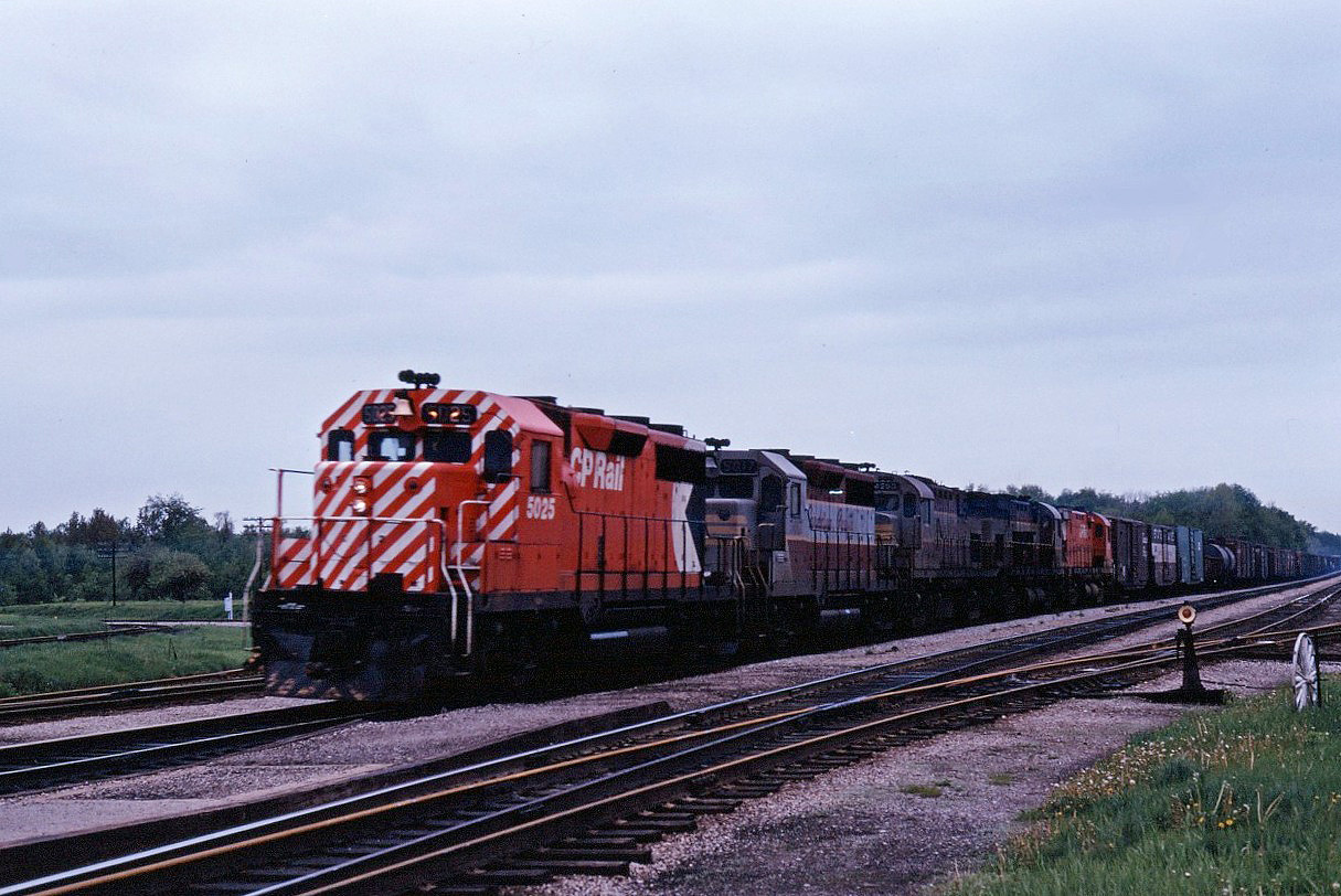The last of CP's 24 GP35s leads an eastbound through Guelph Jct. Another GP35 is trailing, along with CP's first C-424--the 4200-- and two other C424s. Hard to believe that 50 years have passed since this shot was taken...