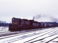 Normally found in Western Canada, today we have GP9 8688 leading FA-1 4015 through Guelph Jct during the winter of 1970.
