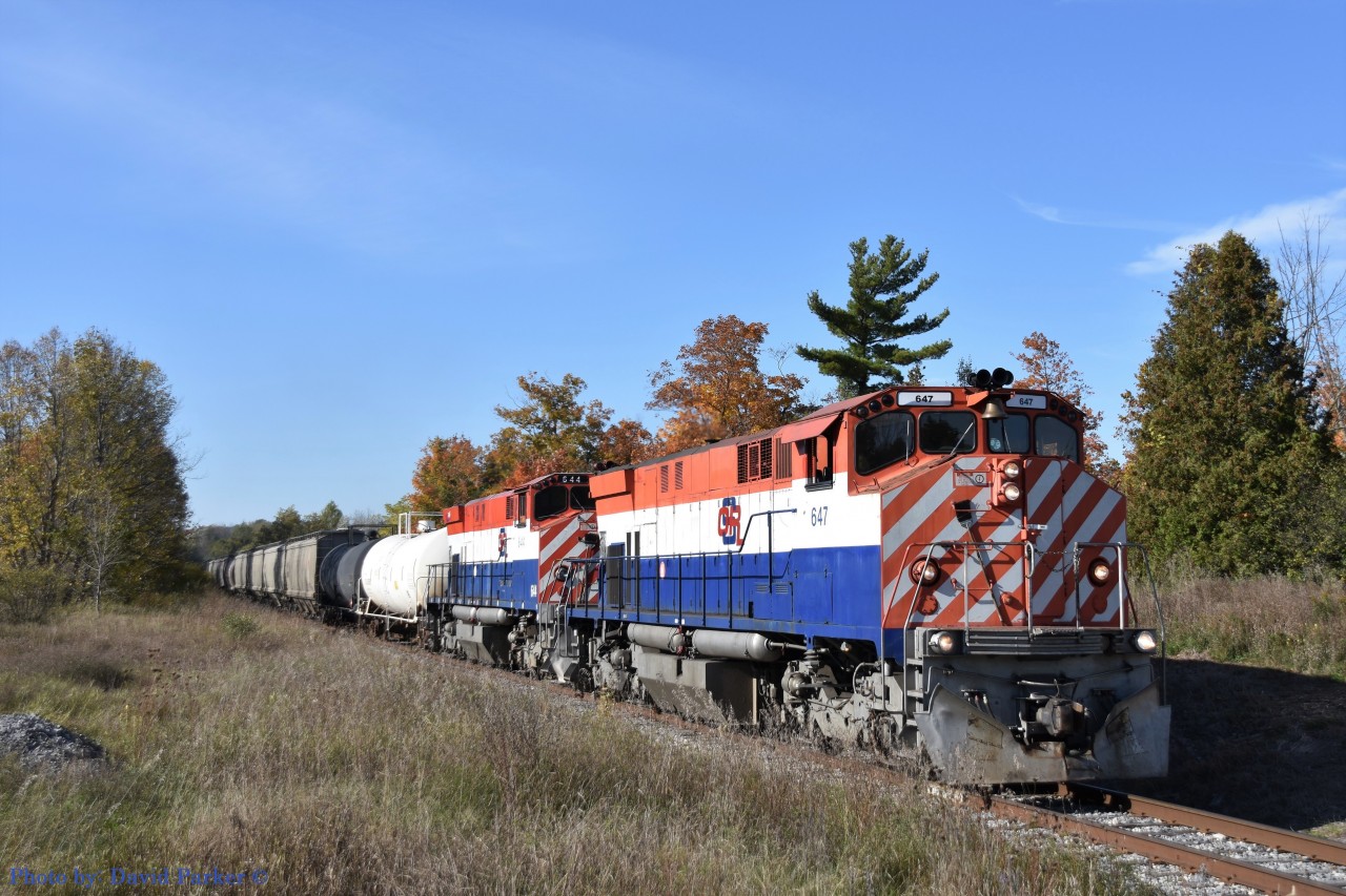 A beautiful fall afternoon finds the Ontario Southland departing Guelph, at Stone Road, heading back to Guelph Jct with a new crew and both Ex BC Rail M420W's 647 & 644. Oct 10th 2019.