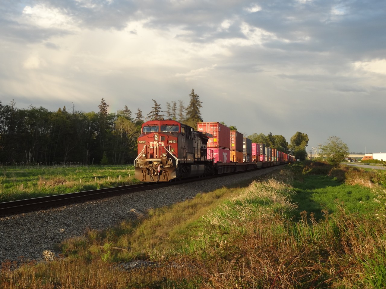 Early evening, first week of May, 2020. Trailing DPU CP 9812, E/B intermodal, the Sun at their back, just passed through Colebrook Siding enroute to Pratt. I took the photo near the BCR Port Sub main track, just east of the King George overpass.