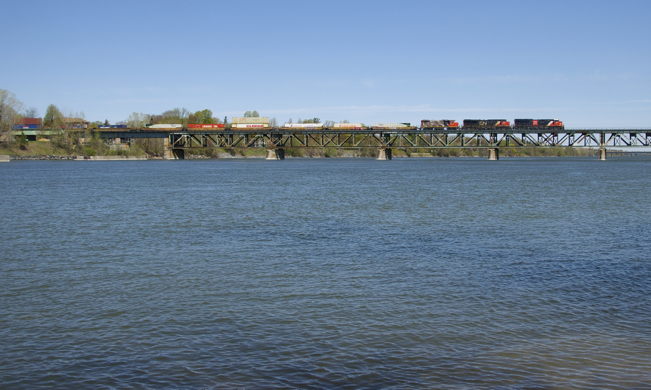 CN 120 with CN 3236, CN 2898 and CN 4711 up front (and CN 3007 mid-train) is crossing the Richelieu River, on its way to Halifax.