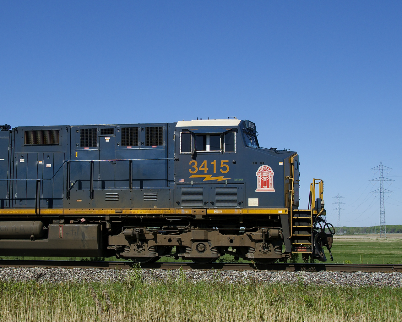 The leader on CN 327 (CSXT 3415) has a decal for CSX predecessor Georgia Railroad as it heads south on the wye leading from the Kingston Sub to the Valleyfield Sub.