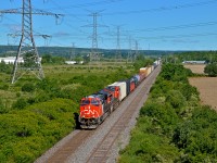 Leaving the countryside behind, 421 passes through Mansewood with a pair of GEVOs up front.